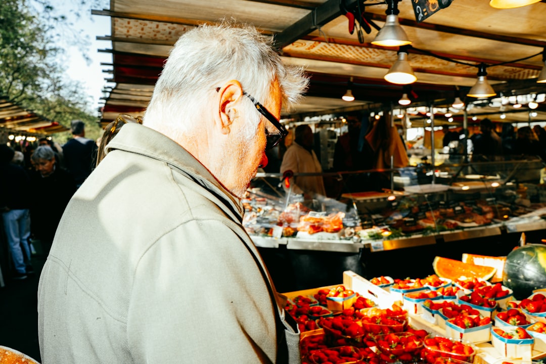 Man browsing produce at an outdoor market
